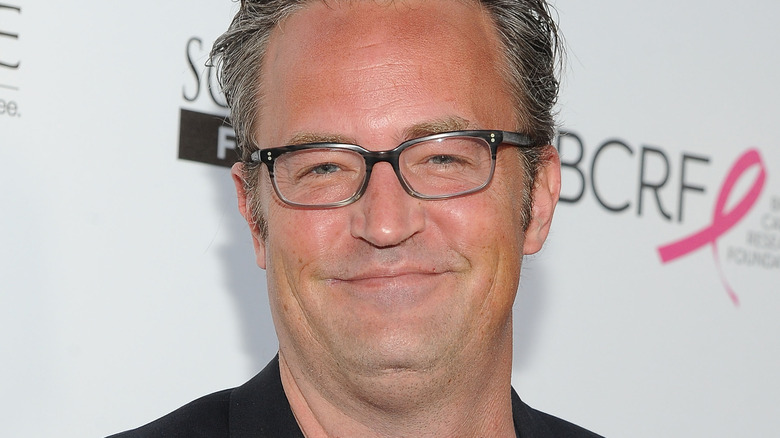 Matthew Perry smiling in close-up