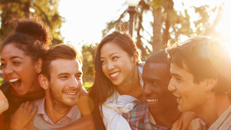 Group of men and women laughing