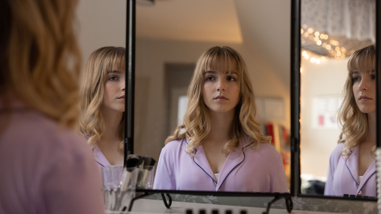 Mckenna Grace looking into mirror