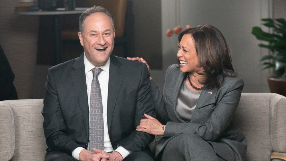 Doug Emhoff and Kamala Harris laughing during a CBS interview