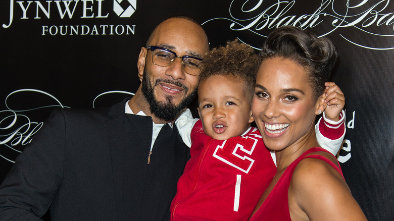 Swizz Beatz and Alicia Keys holding Egypt Dean