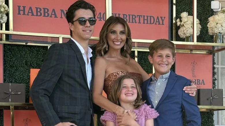 Alina Habba smiling with her children