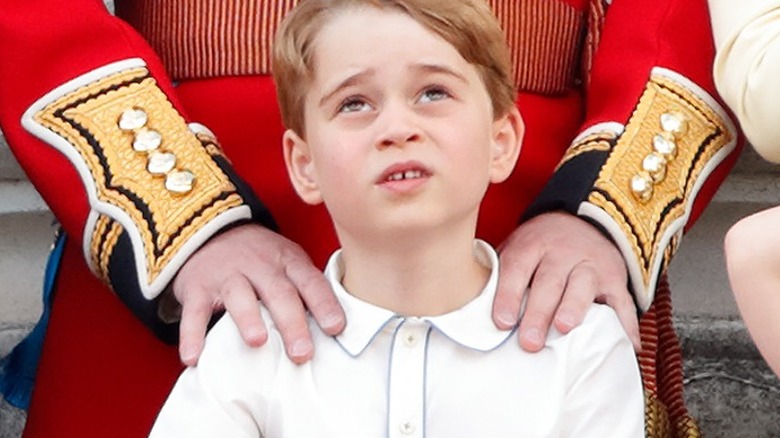 Prince George looking up at his dad 