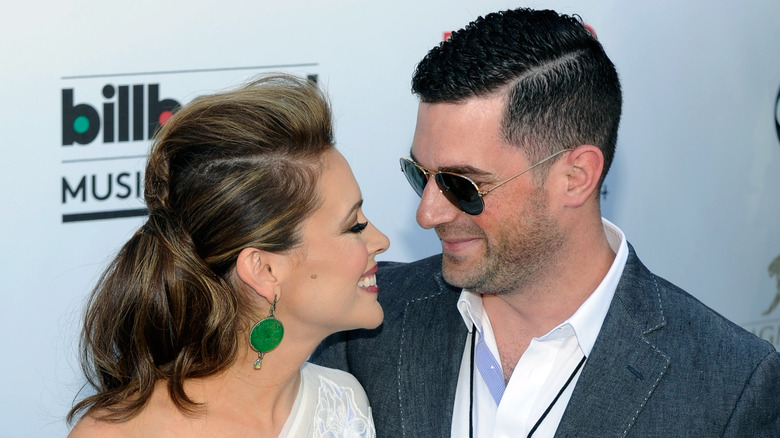 Alyssa Milano and David Bugliari looking at each other