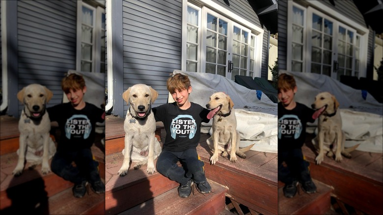 Max Bratman posing with puppies