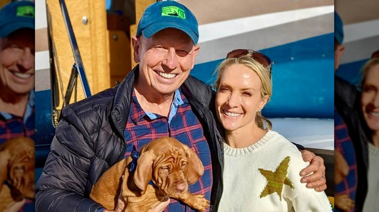 Peter McMahon and Dana Perino posing with their puppy