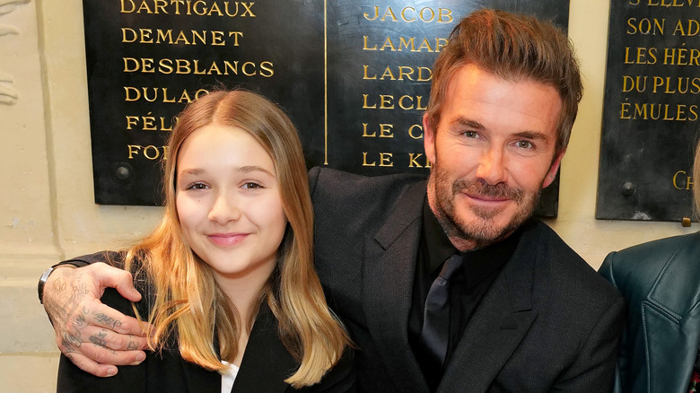 David and Harper Beckham black suit