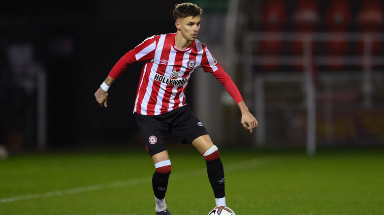 Romeo Beckham playing soccer