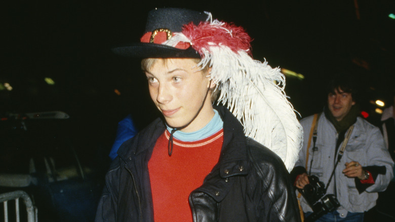 Duncan Jones wearing a feathered cap