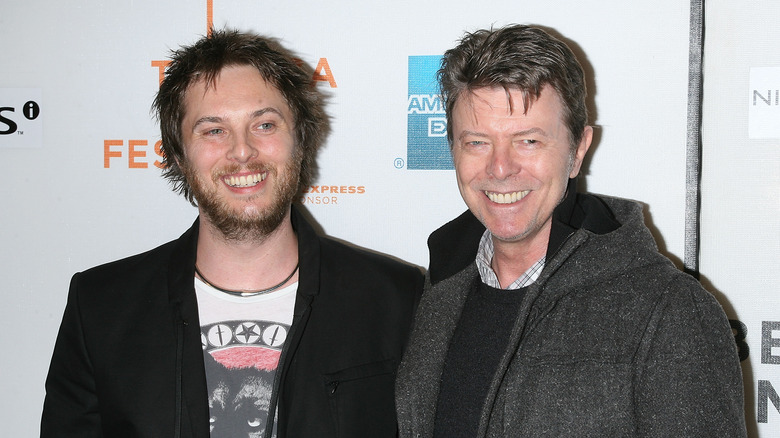 Duncan Jones and David Bowie smiling 