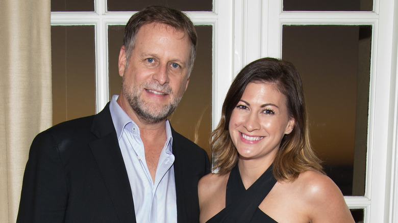 Dave Coulier and his wife, Melissa Bring posing