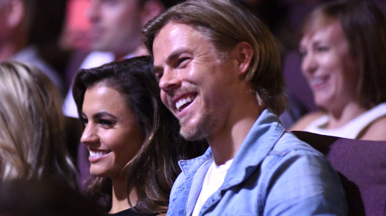 Hayley Erbert Hough and Derek Hough watching a performance together