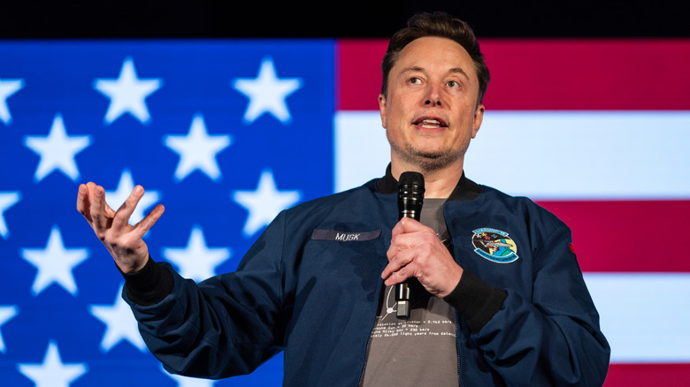 Elon Musk speaking onstage at an event