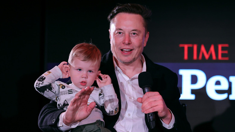 Elon Musk holding his son X Æ A-12