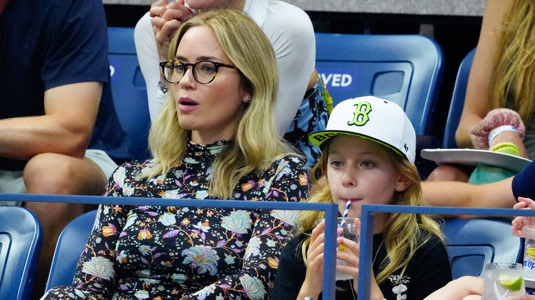 Emily Blunt sits with her daughter Hazel