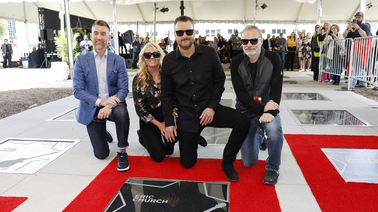 Katherine Blasingame and Eric Church kneeling 