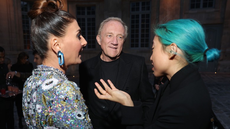 François-Henri Pinault conversing with women