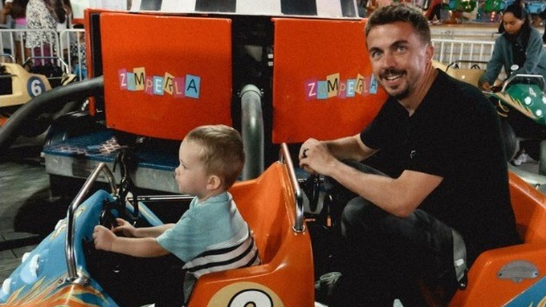 Mauz and Frankie Muniz on amusement park ride