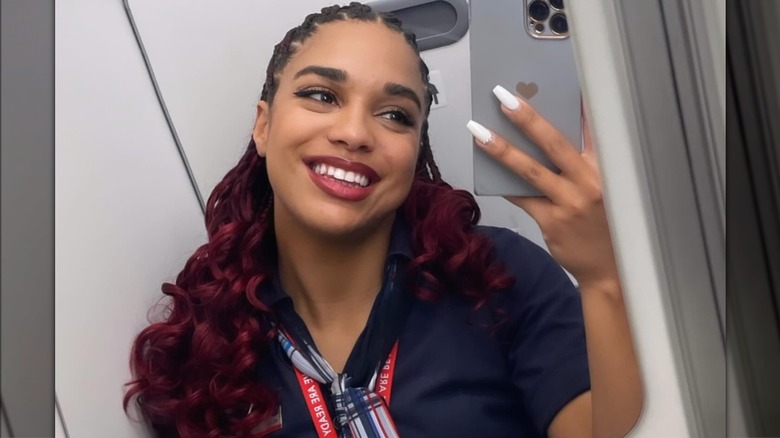 Bella Cameron taking selfie in airplane