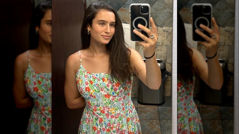 Olivia Cameron taking selfie in floral dress