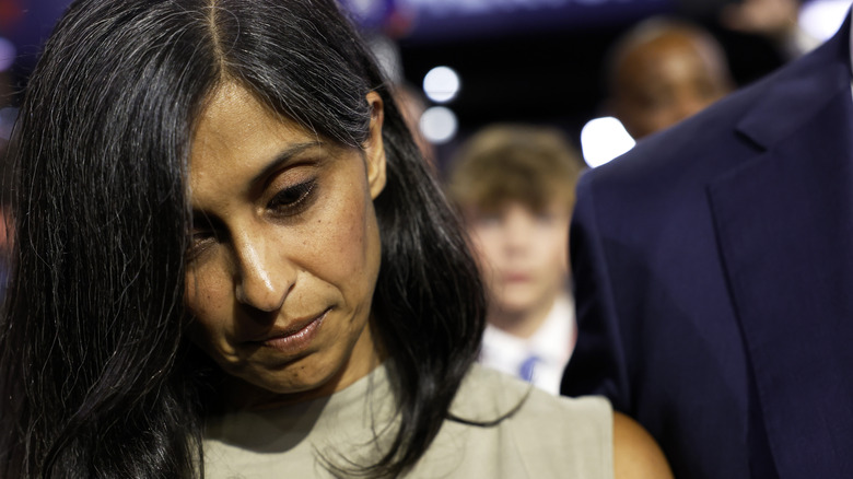 Usha Vance looks down away from the camera 