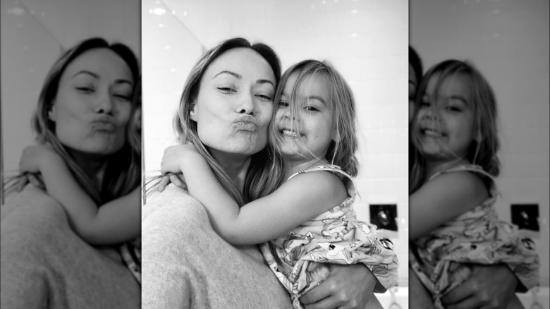 Olivia Wilde holding daughter Daisy Sudeikis 