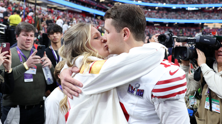 Jenna Brandt kissing Brock Purdy