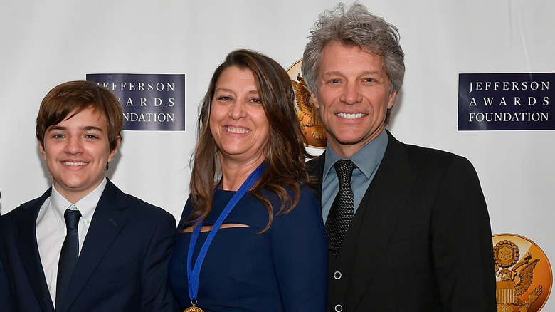 Romeo Bongiovi with parents, smiling 