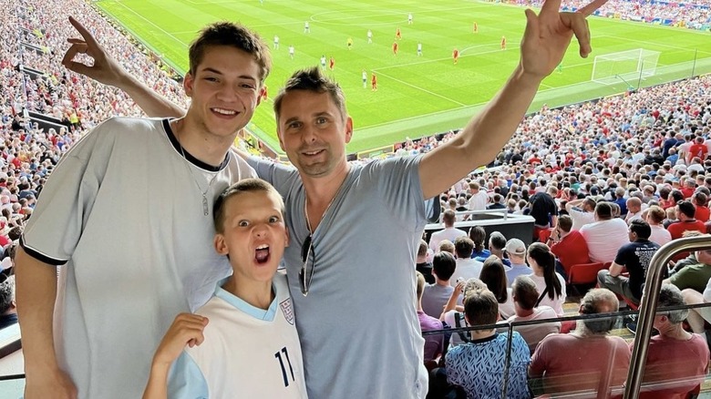 Ryder Robinson, Bing Bellamy, Matt Bellamy posing at soccer game