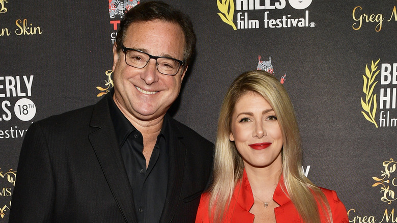 Bob Saget smiling with wife Kelly Rizzo