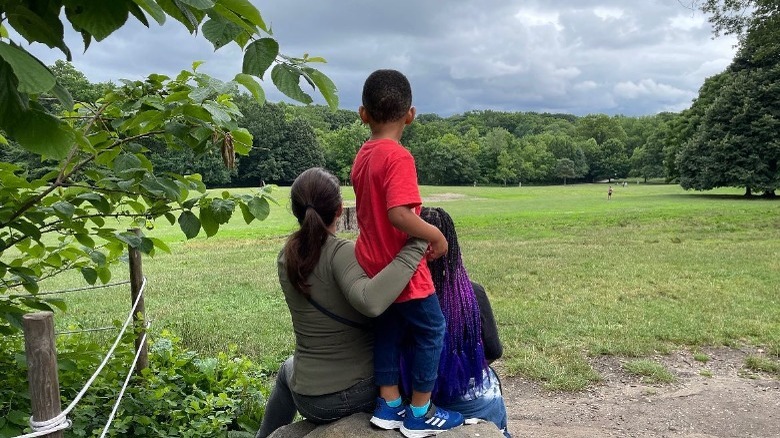  Kristin Davis looking at forest with kids