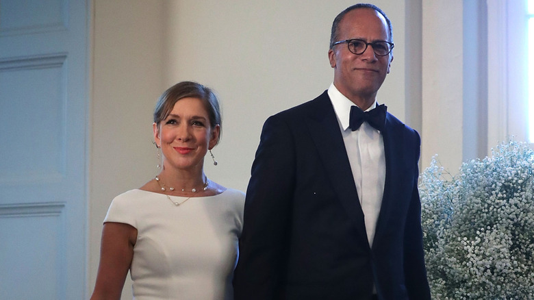 Lester Holt and Carol Hagen walking