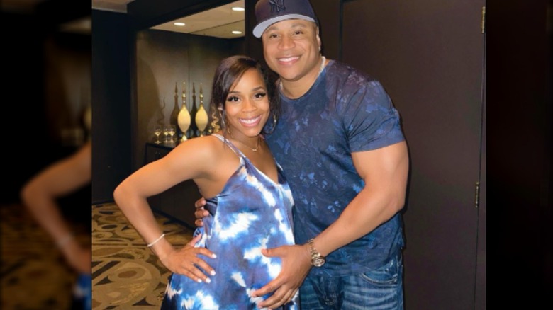 Pregnant Italia Smith smiling with dad LL Cool J