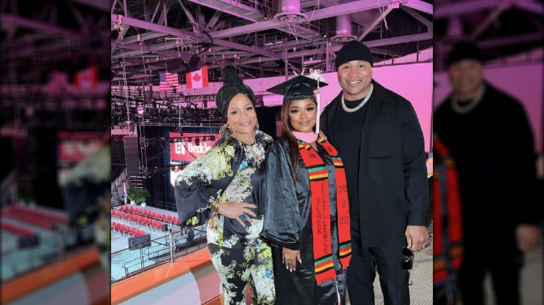 Nina-Symone Smith smiling with her parents at graduation