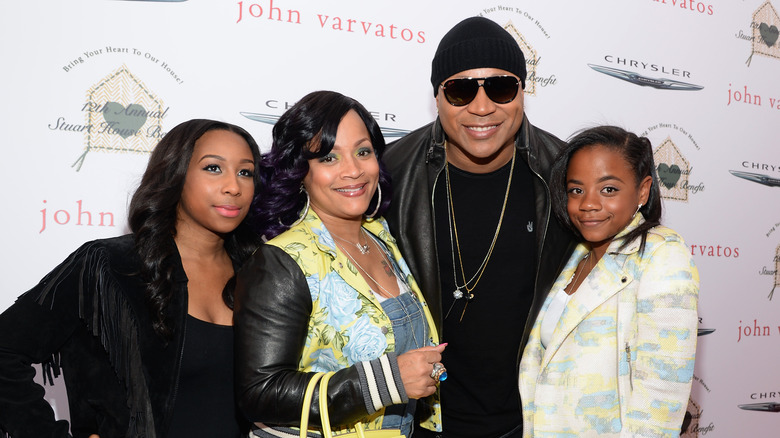 LL Cool J posing with his wife and daughters