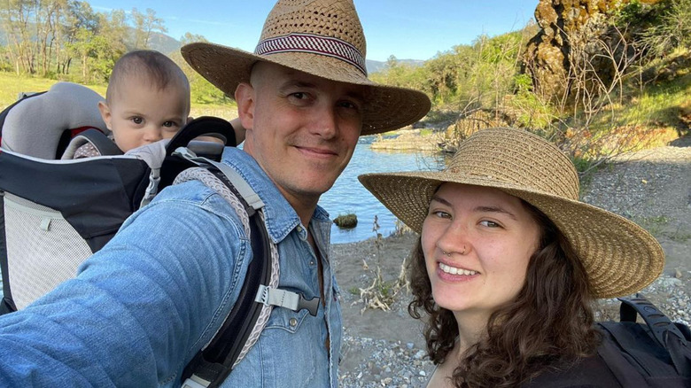Dave and Brianna Schwep in hats with baby