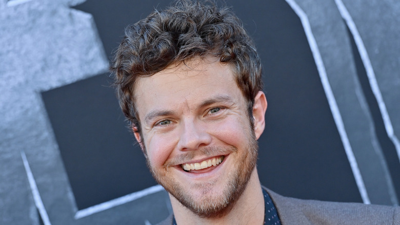 Jack Quaid smiling