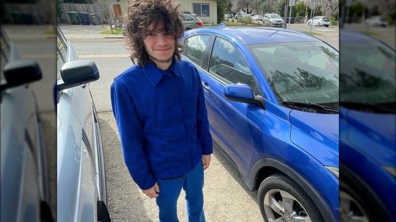 Maxx Morando posing with car