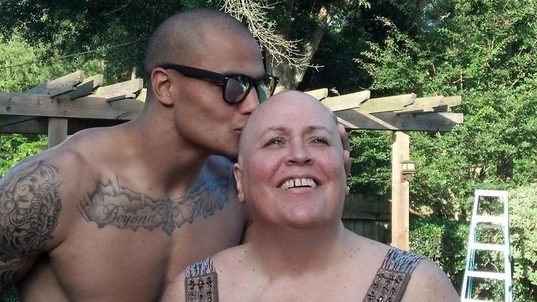 Dak Prescott shirtless kissing mother Peggy Prescott on back of head