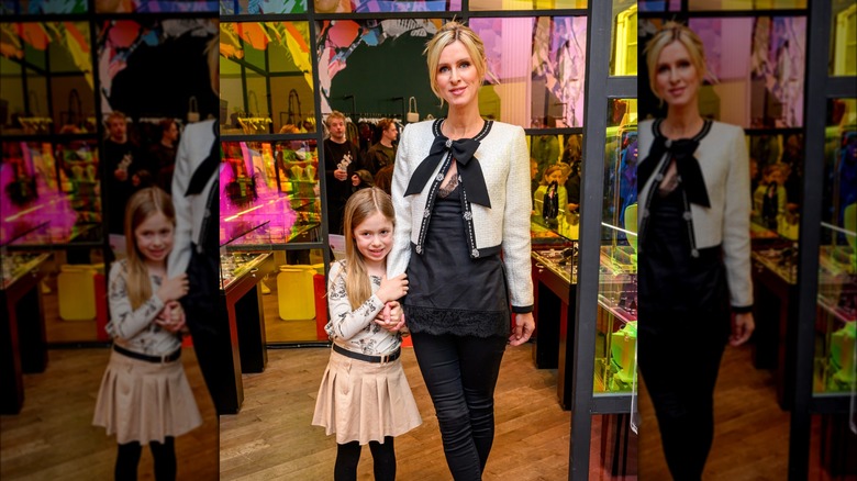 Lily-Grace and mother Nicky Hilton posing