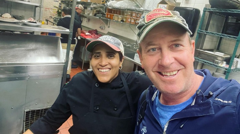 Geoff Tracy in kitchen with chef