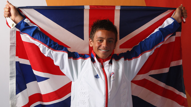 Young Tom Daley posing with a Union Jack 