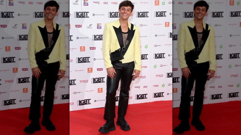 Tom Daley smiling on the red carpet 