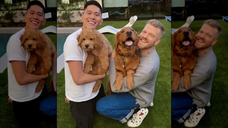 Mark and Scott Hoying smiling with their dogs