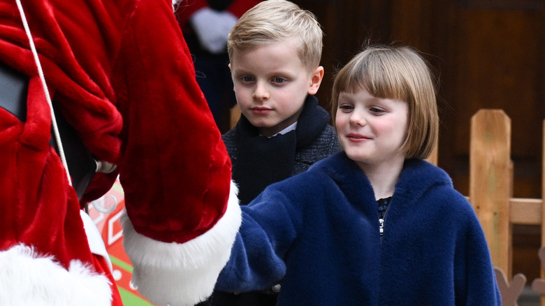 Gabriella and Jacques greet Santa