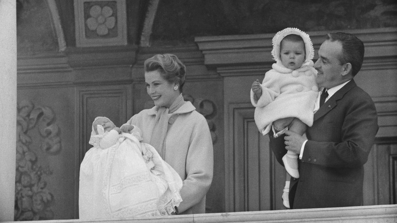 Grace Kelly and Prince Rainier III presenting children