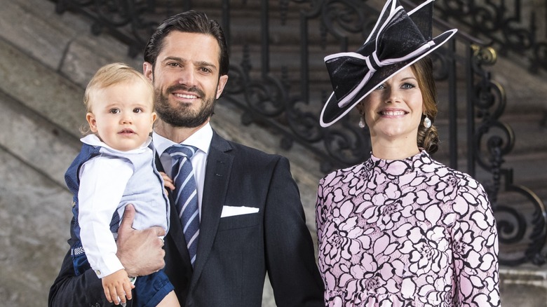 Prince Carl Philip holding Prince Alexander with Princess Sofia