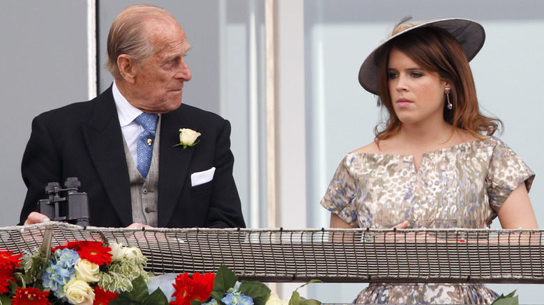 Prince Philip looks at Princess Eugenie