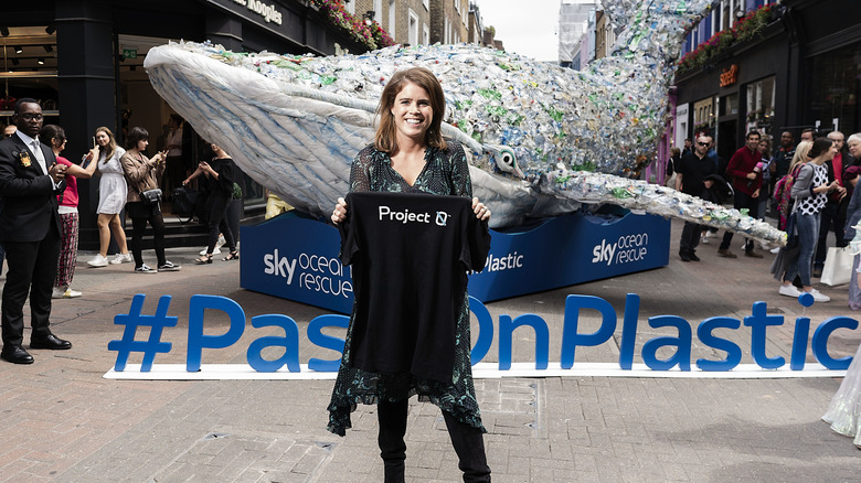 Princess Eugenie holds a black t-shirt