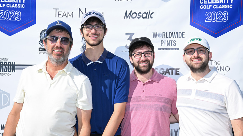 Ray Romano posing for photos with Matthew, Gregory, and Joseph Romano